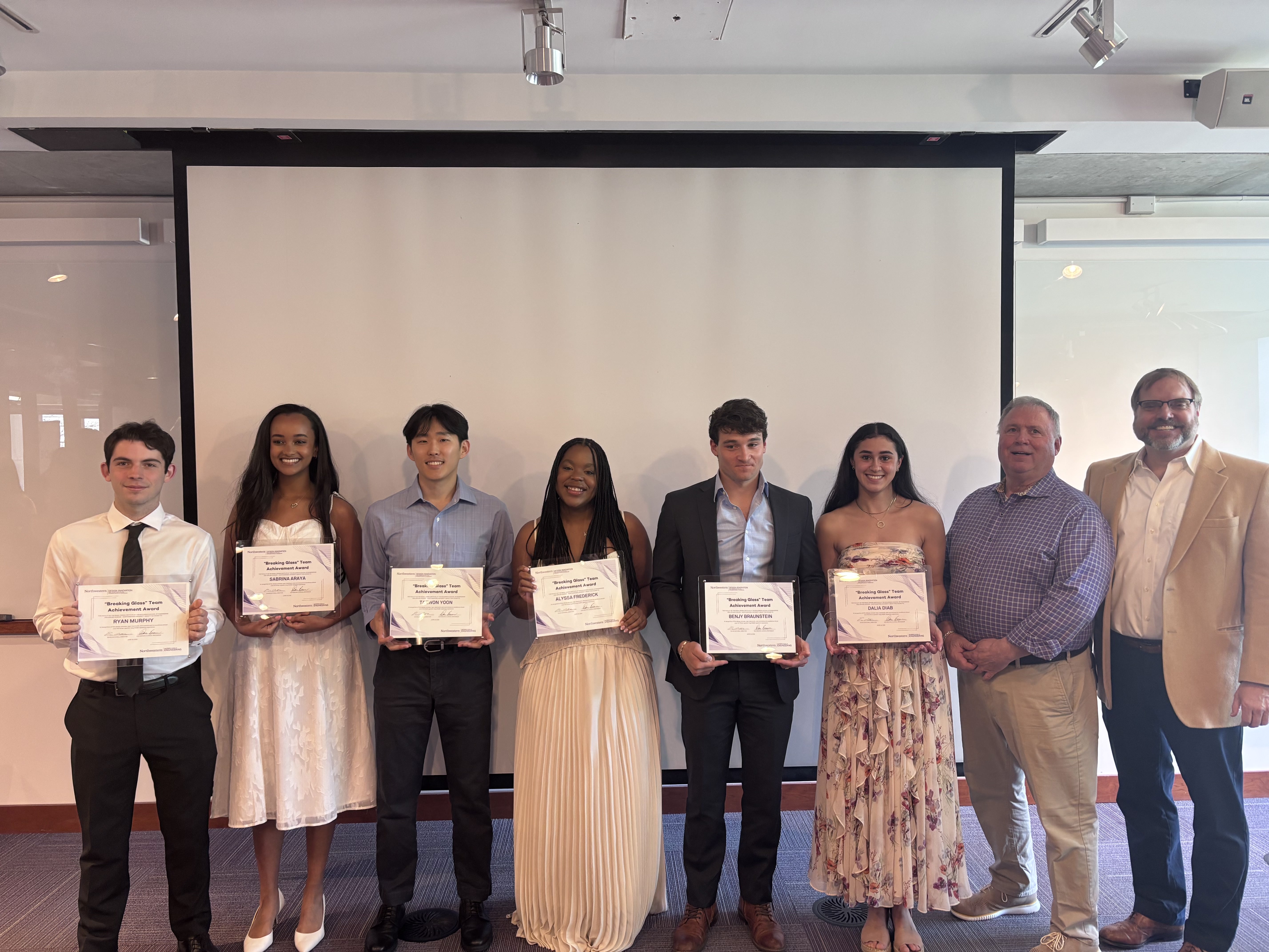 SureThing team receiving the Breaking Glass Award